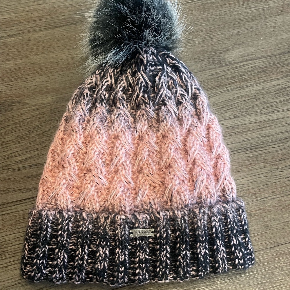 woman’s Pink and black fuzzy hat